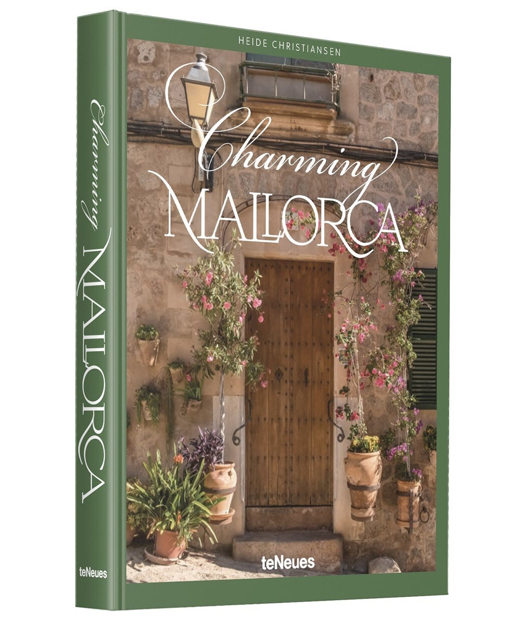 Book cover of 'Charming Mallorca' with a scenic door and plants on a white background