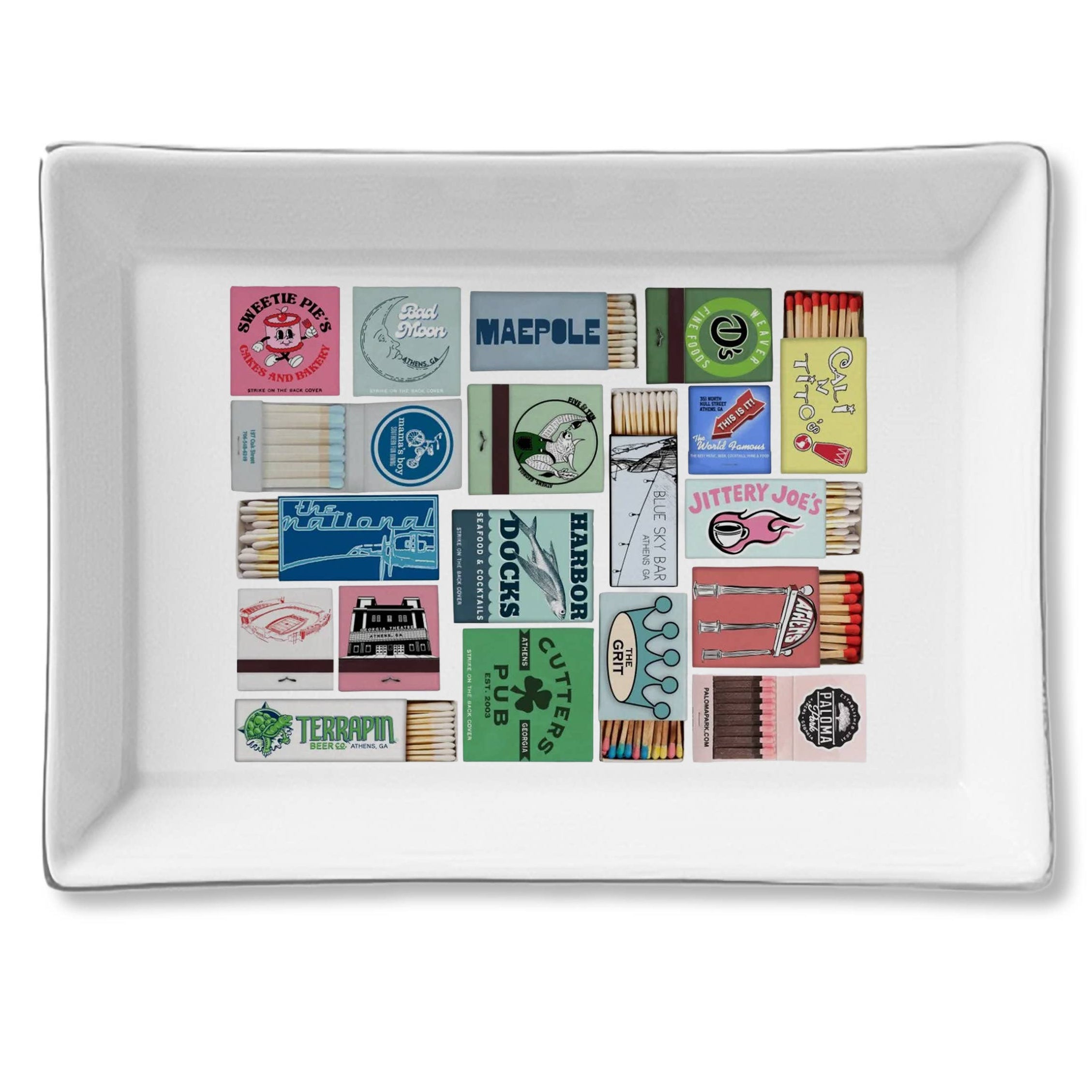 White rectangular tray with colorful matchbook designs on a white background