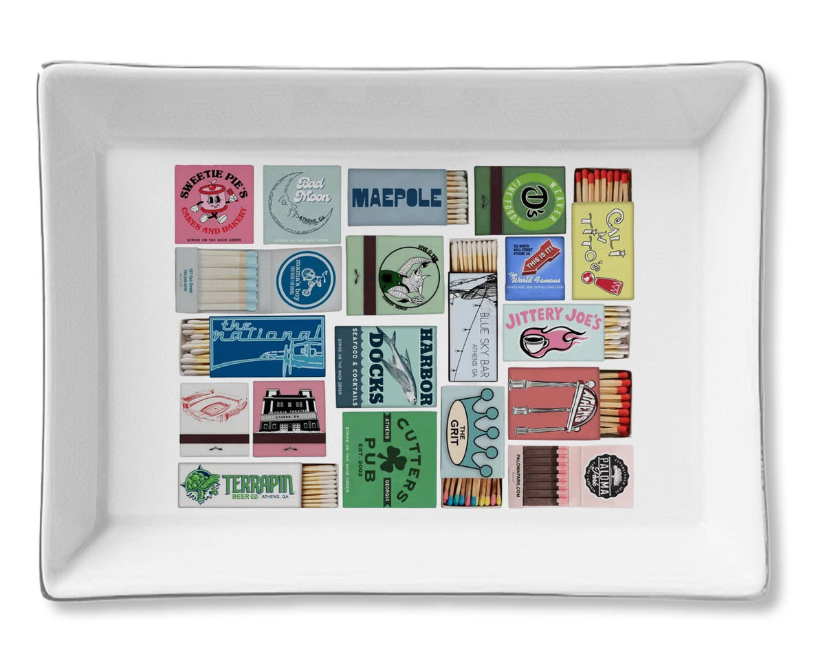 White rectangular tray with colorful matchbook designs on a white background