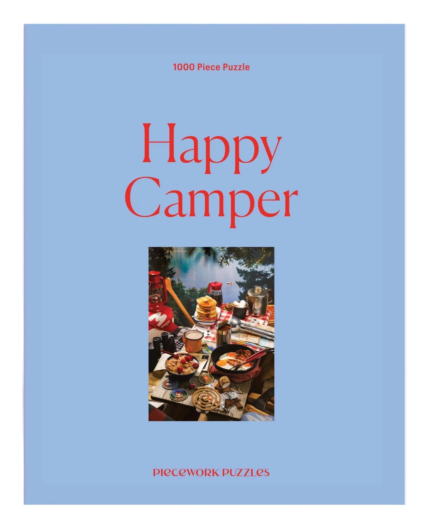 Puzzle box titled 'Happy Camper' with a blue cover and photo of a camper interior.