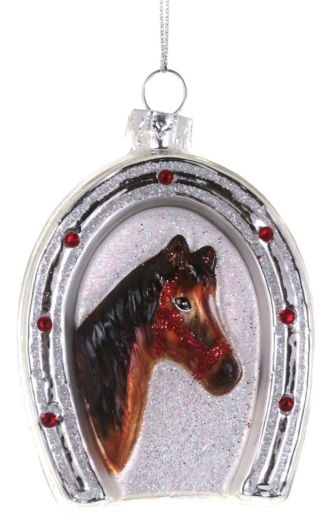 Decorative ornament with a horse head in a horseshoe on a white background