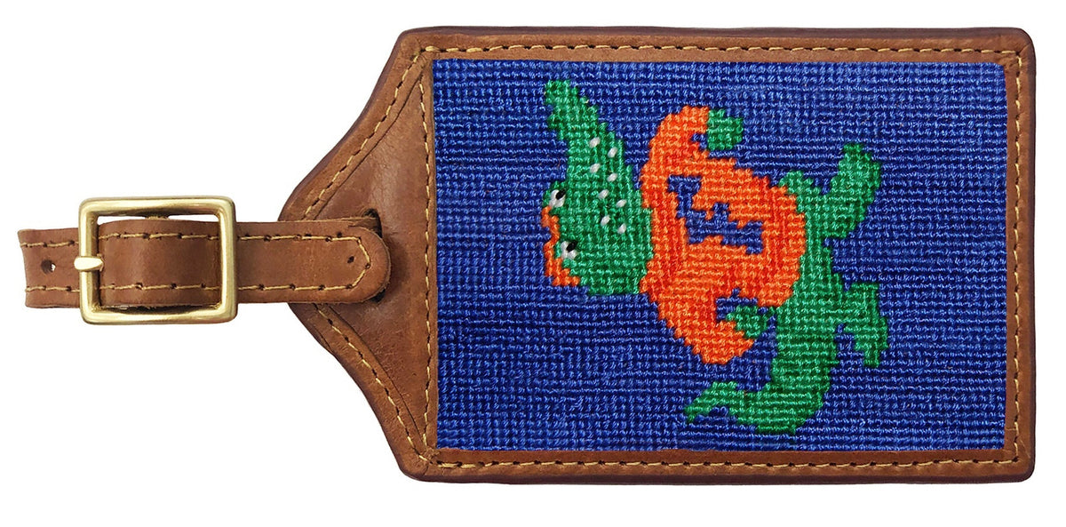 Luggage tag with a colorful fish design on a blue background