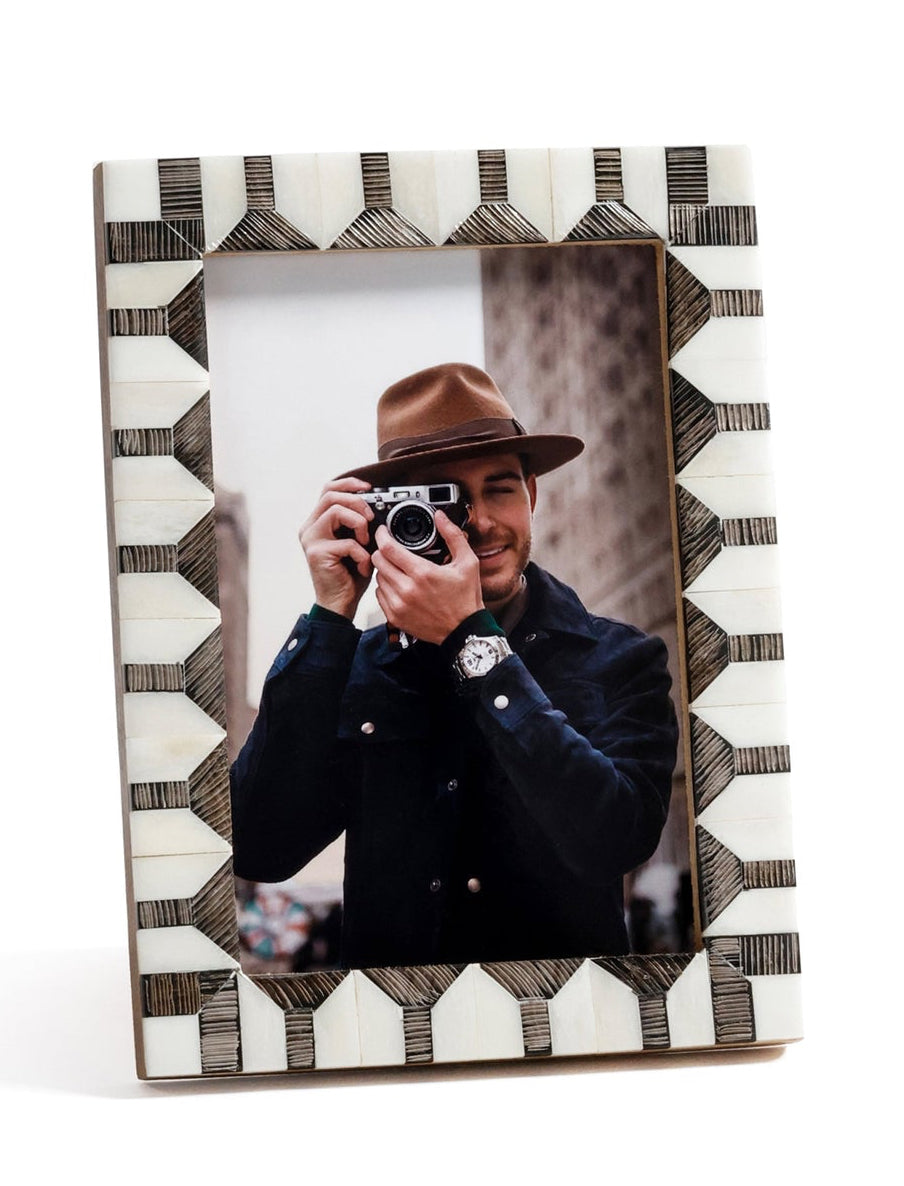 Decorative photo frame with geometric pattern on a white background