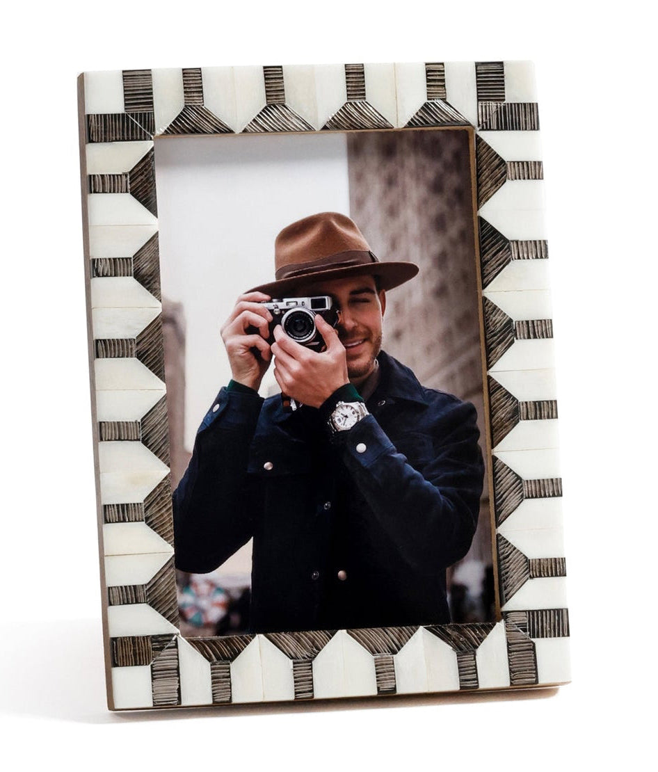 Decorative photo frame with geometric pattern on a white background