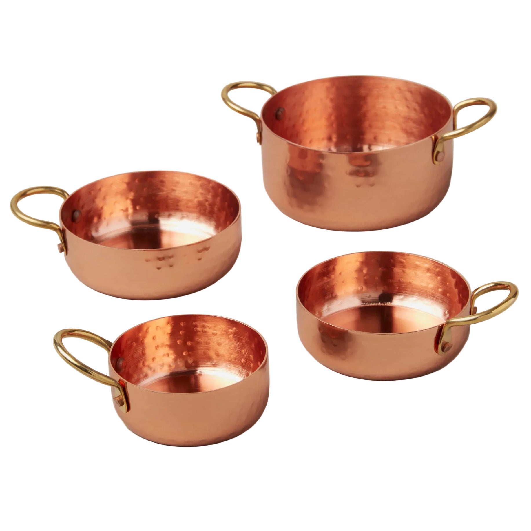 Set of four copper cookware items with gold handles on a light gray background