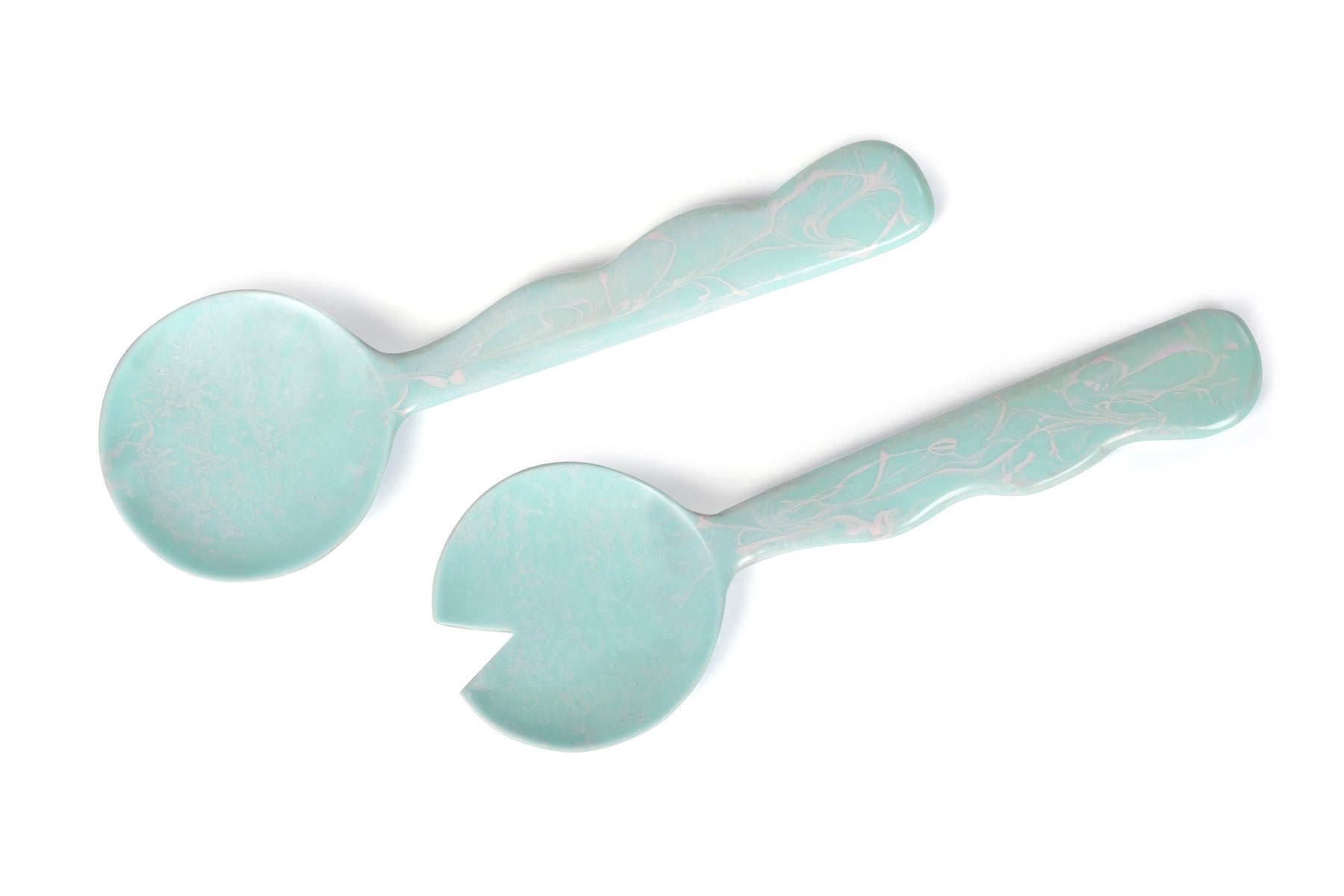 Two light blue spoons on a white background
