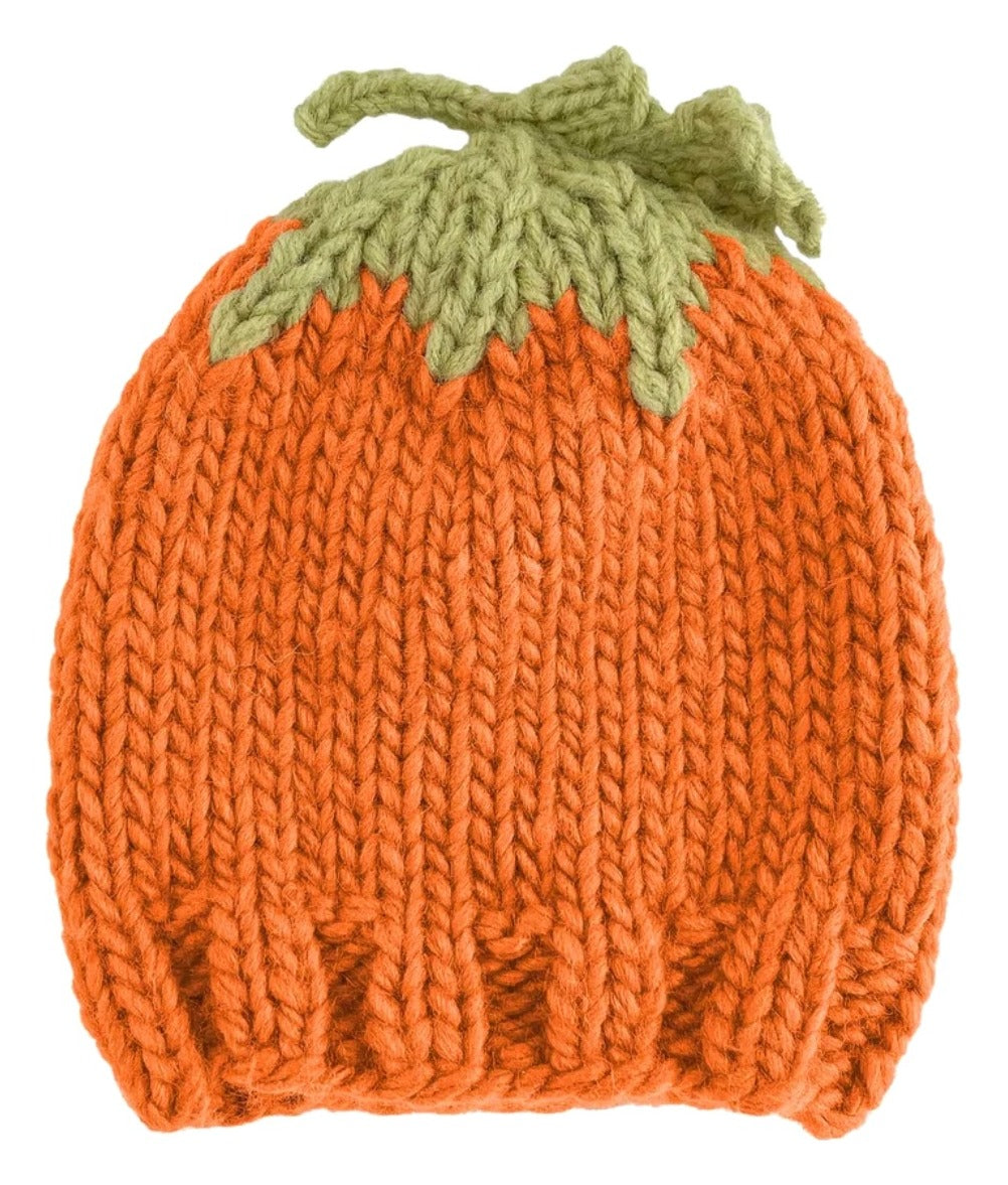 Knitted pumpkin hat with green stem on a white background