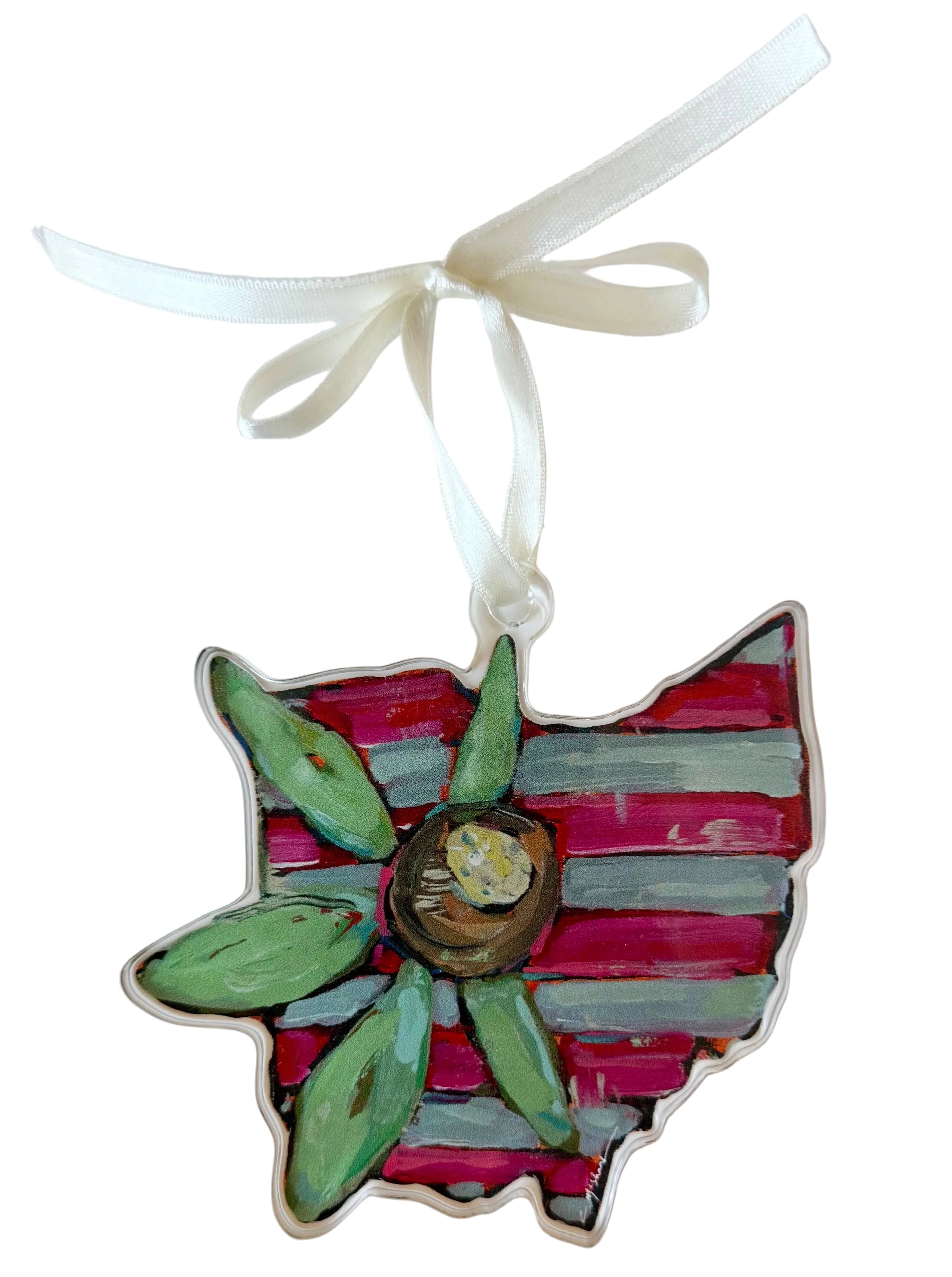 Decorative ornament shaped like a flower with red and green petals on a white background