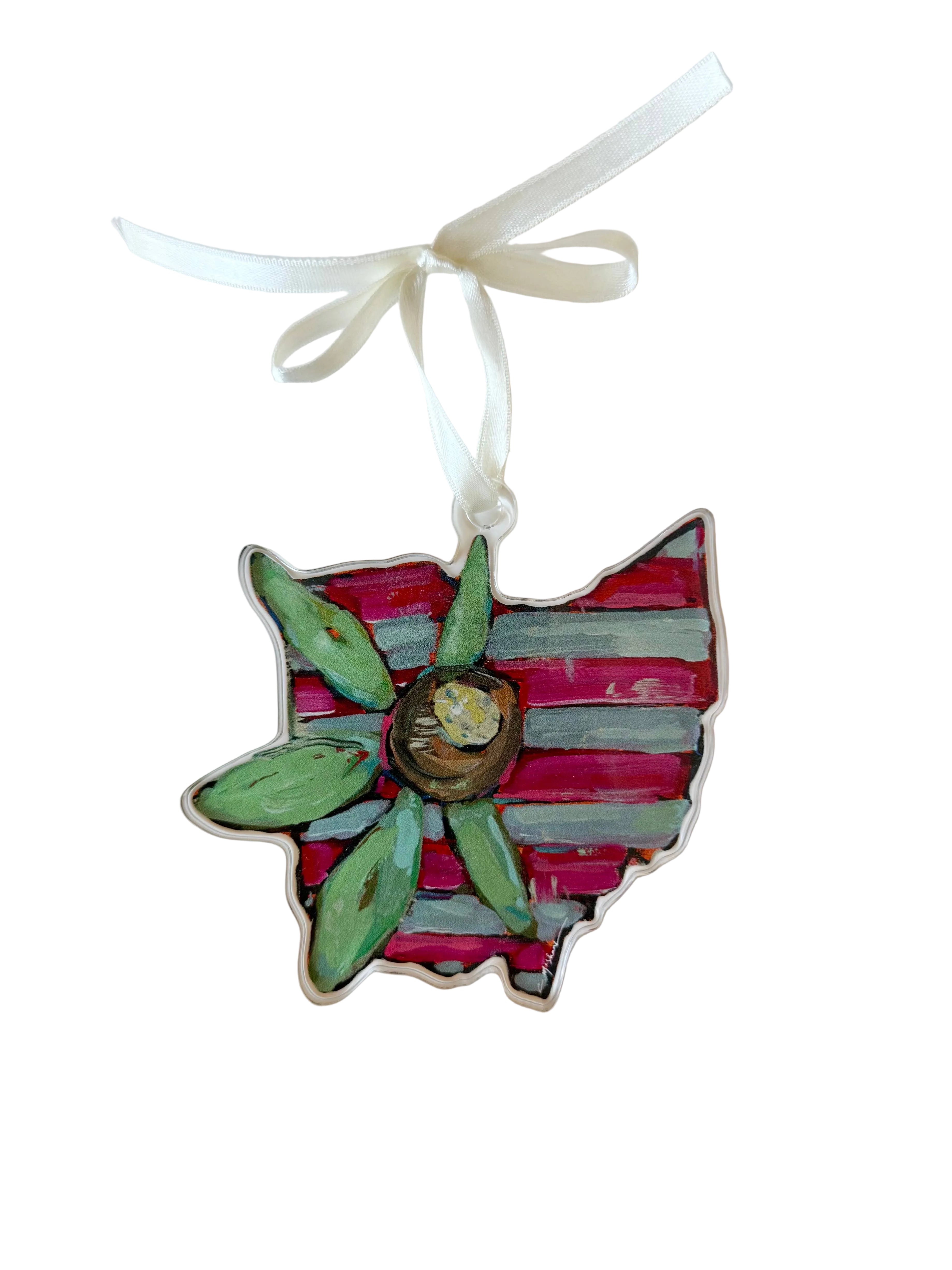 Decorative ornament shaped like a flower with red and green petals on a white background