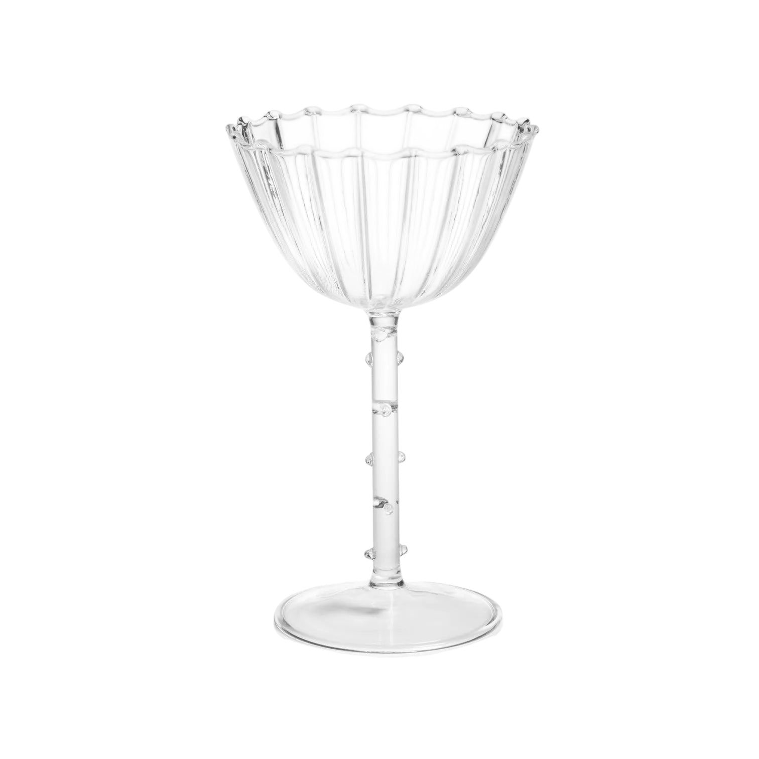 Clear glass cocktail cup with decorative rim on a white background
