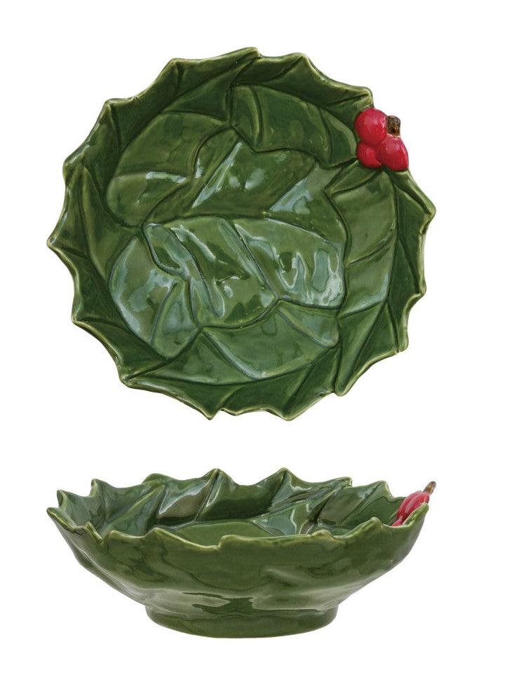 Two green ceramic leaf-shaped bowls on a white background