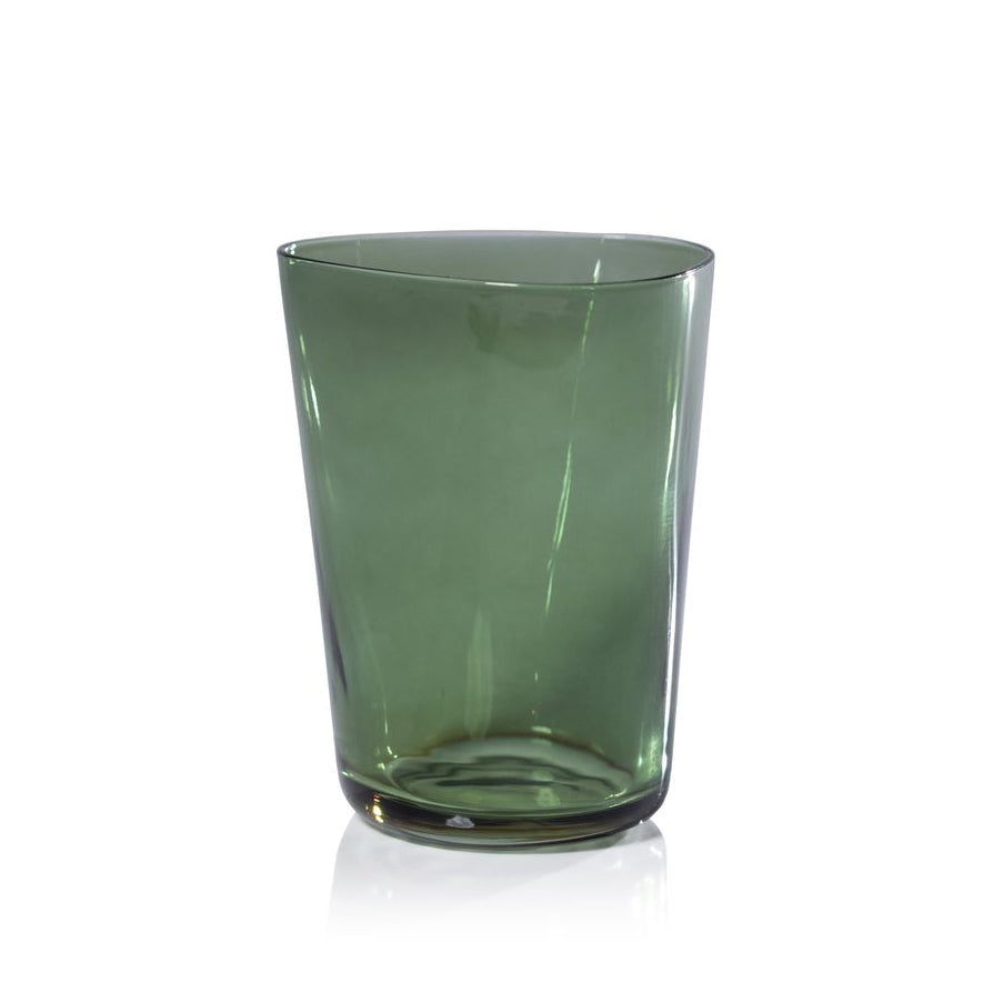 Green glass tumbler on a white background