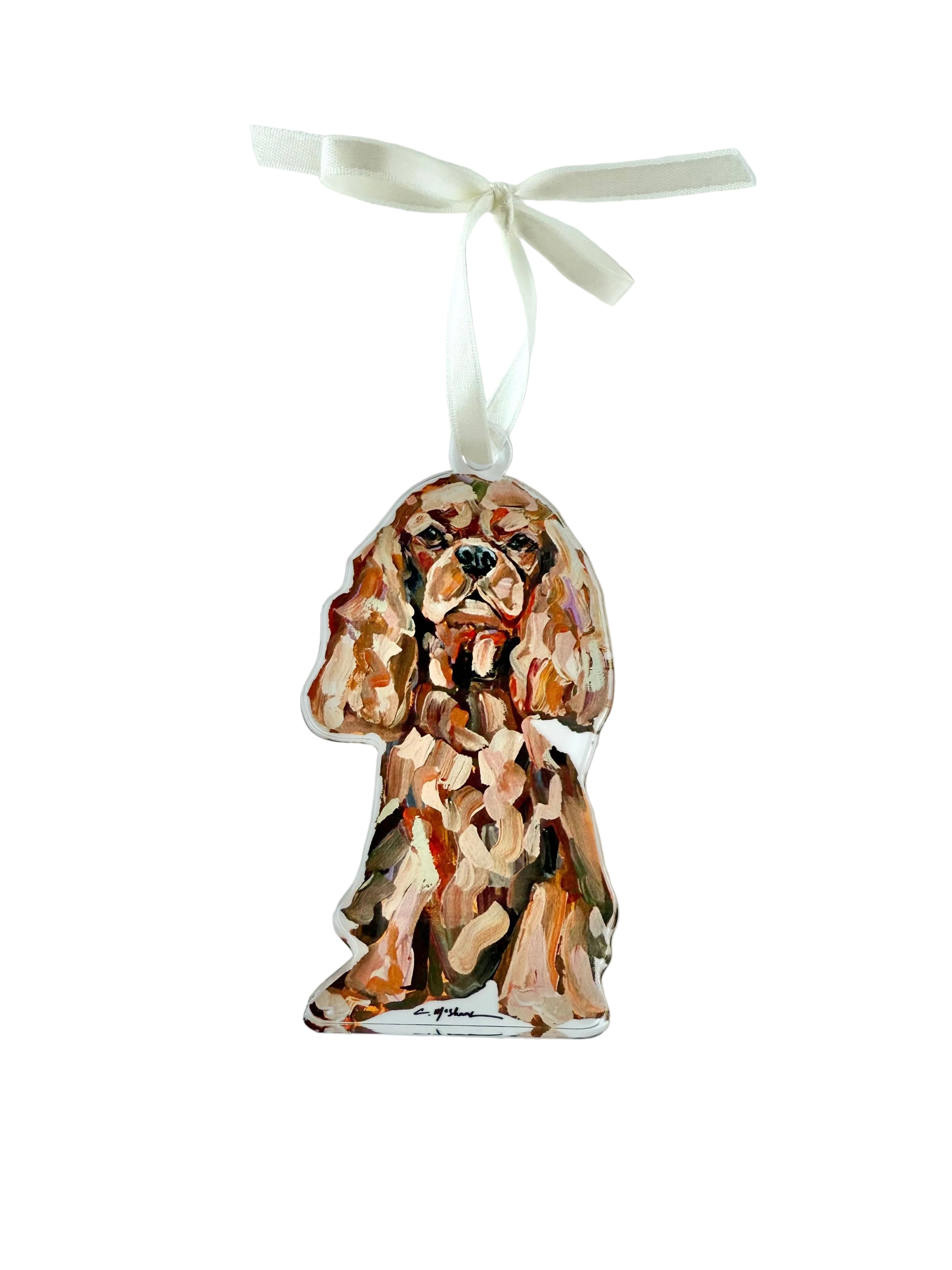 Decorative ornament of a dog with a white ribbon on a light gray background