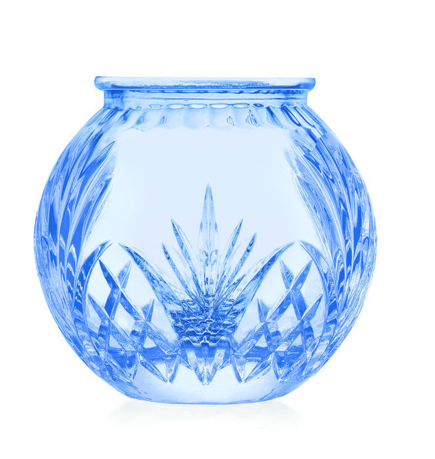 Blue glass vase with textured surface on a white background