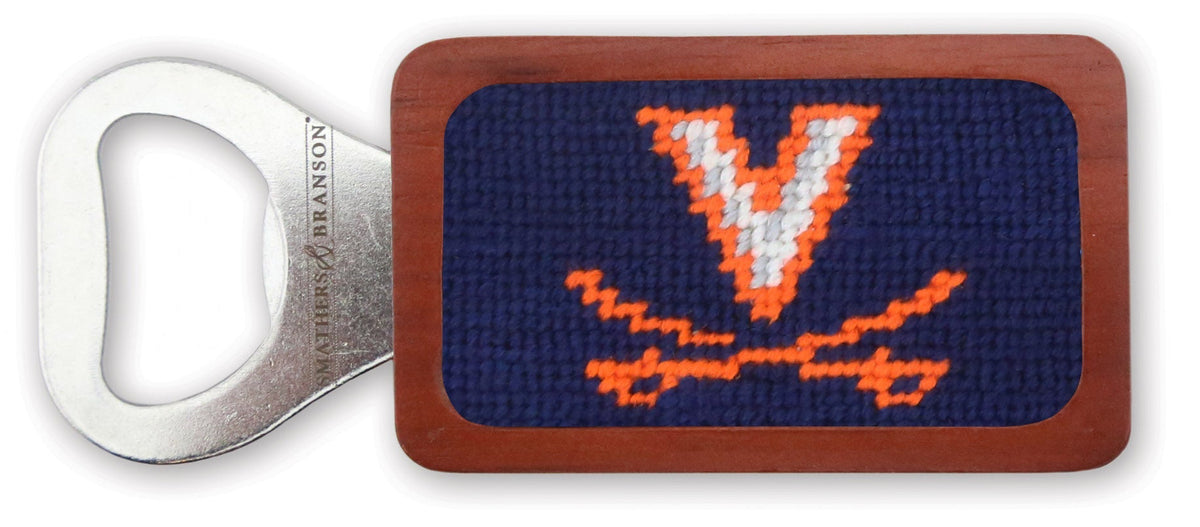 Bottle opener with a needlepoint design featuring a logo on a white background