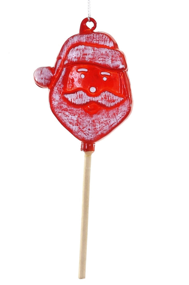 Red Santa Claus lollipop on a white background