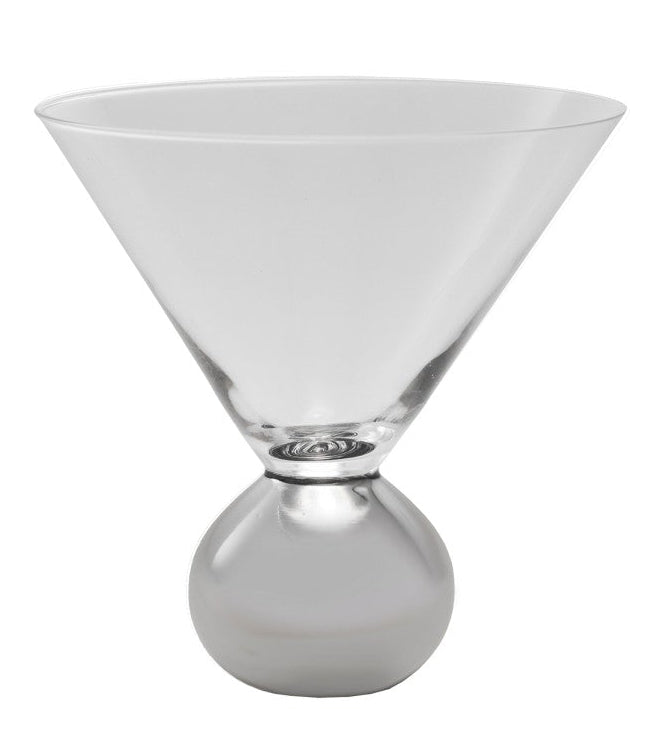 Clear glass martini glass with a silver base on a white background