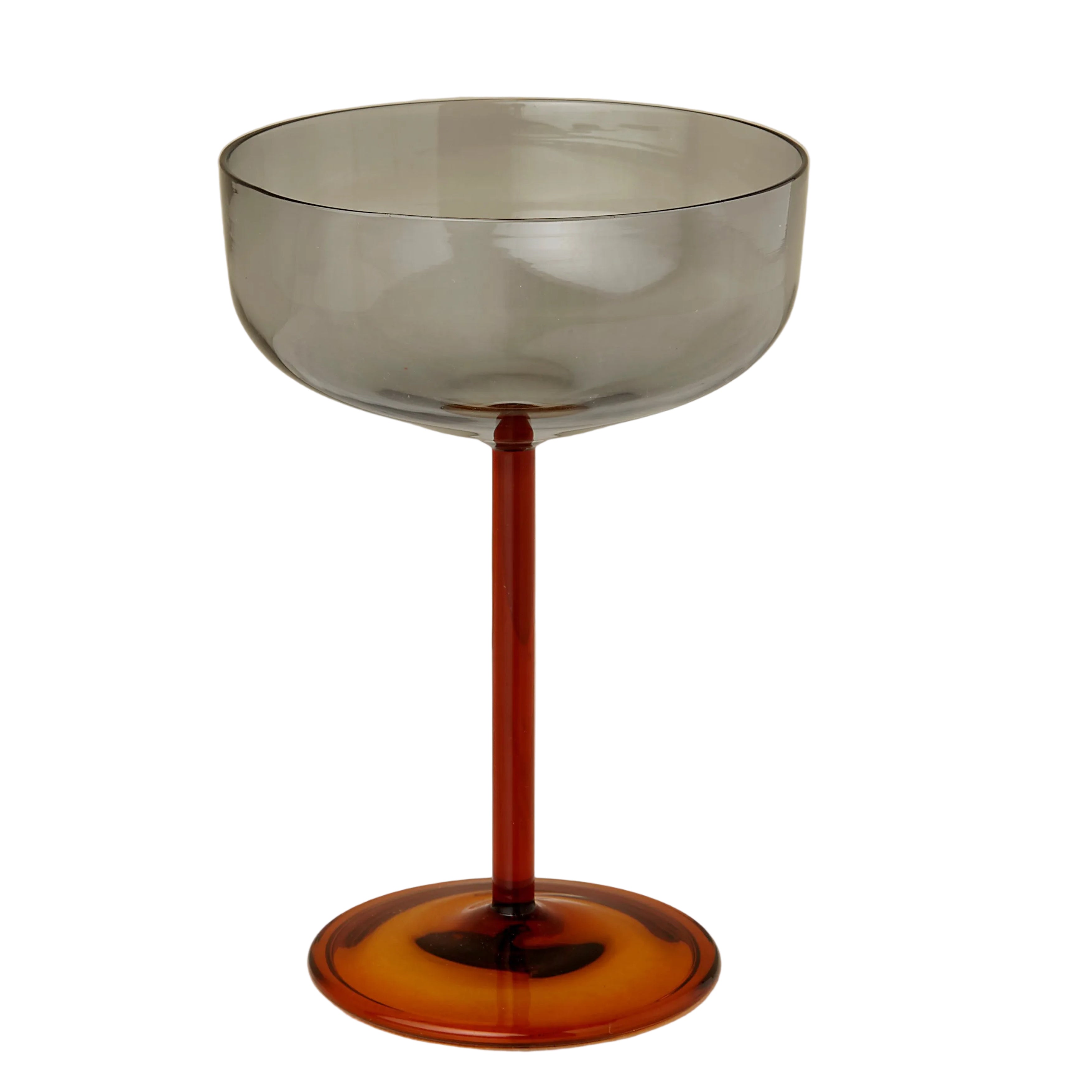 Glass with a gradient from clear to amber on a marble surface