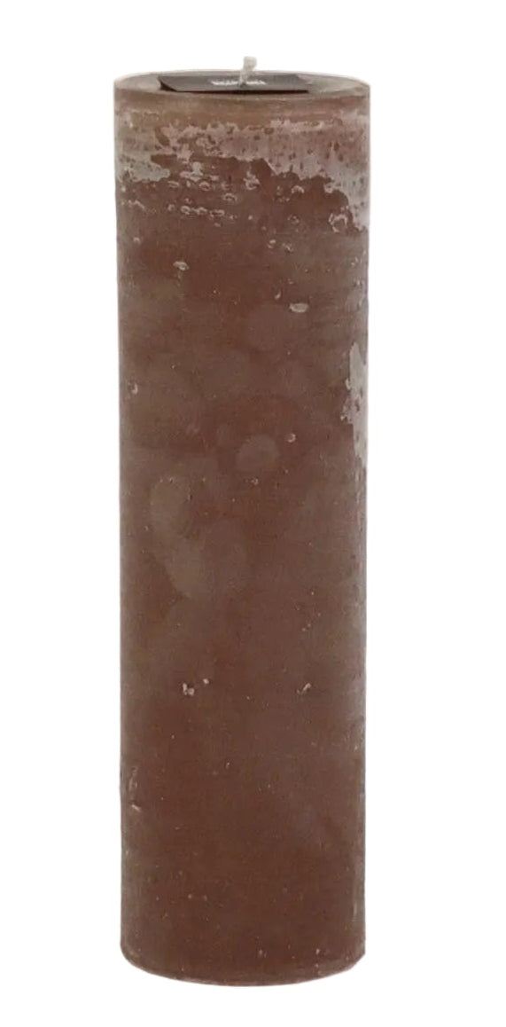 A single tall cylindrical brown candle with a rustic, textured wax finish and a small wick at the top, isolated on a white background.