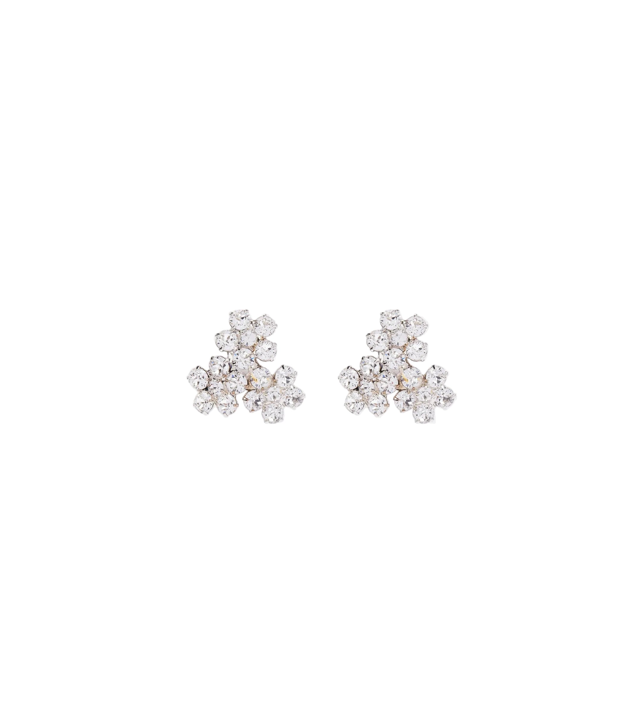 Pair of floral earrings with clear stones on a light gray background