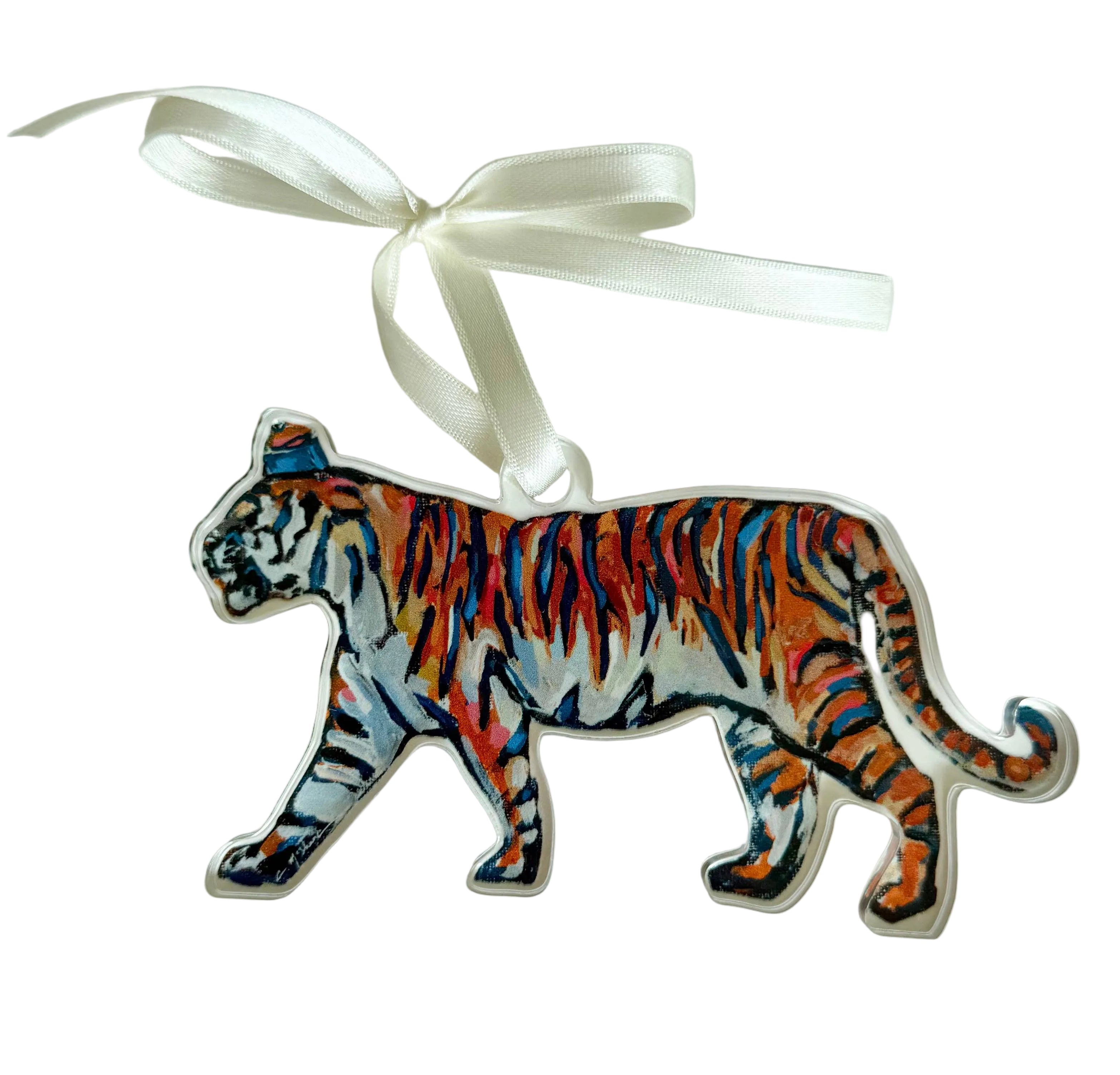Decorative tiger ornament with a white ribbon on a light gray background