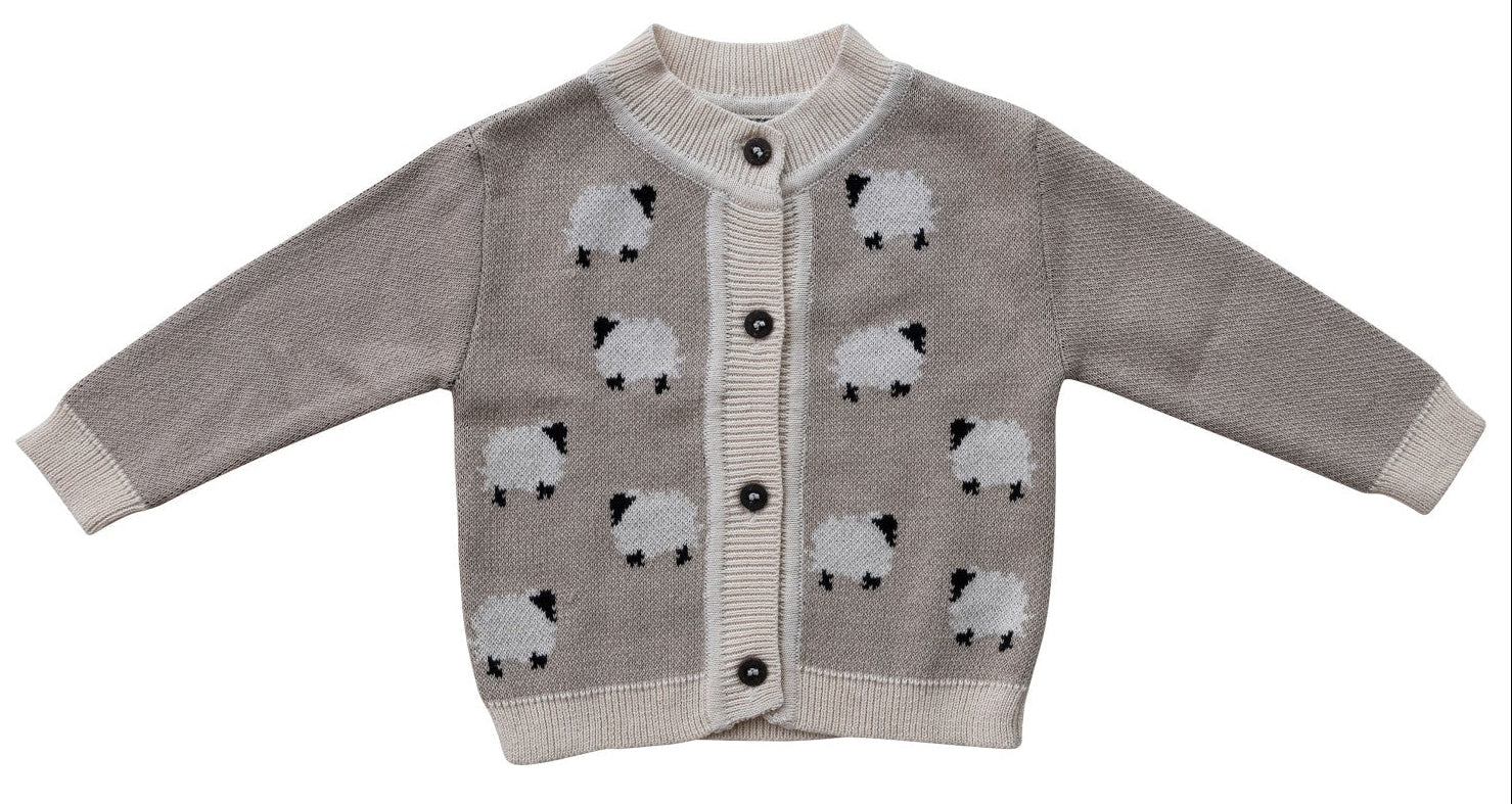 Children's cardigan with sheep pattern on a white background