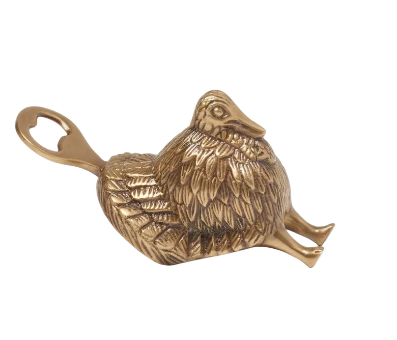 Bronze chicken-shaped bottle opener on a white background
