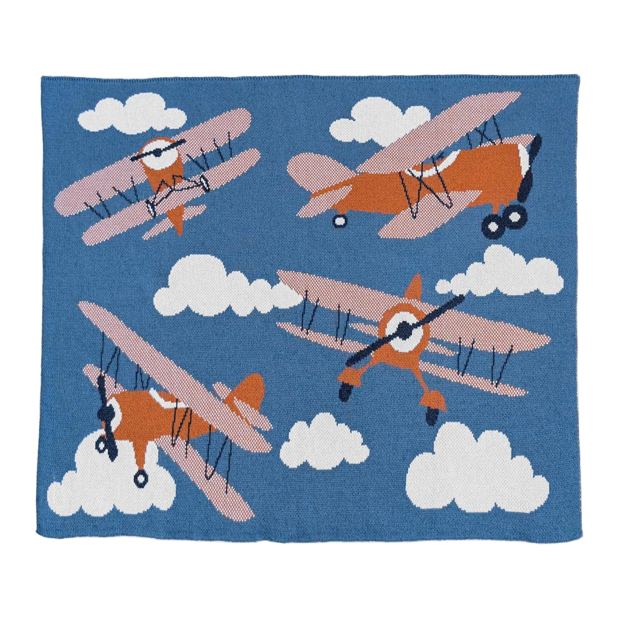 Children's blanket with orange biplanes and white clouds on a blue background