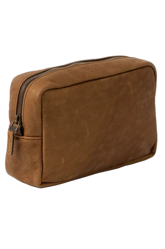 Brown leather toiletry bag on a white background