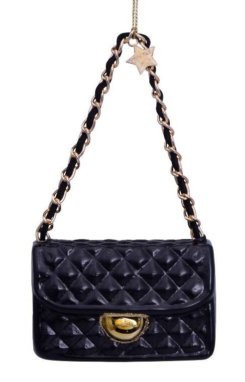 Black quilted handbag with gold clasp and chain strap on a white background