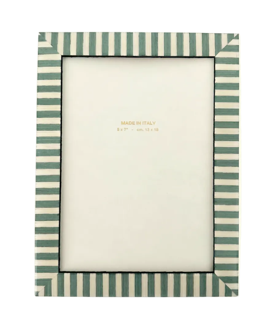 Striped photo frame with a white center on a light beige background