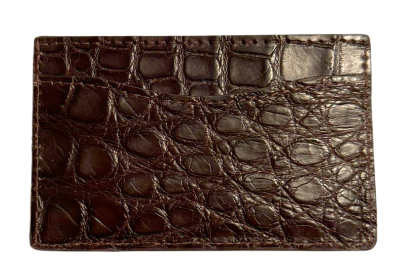 Brown crocodile skin wallet on a white background