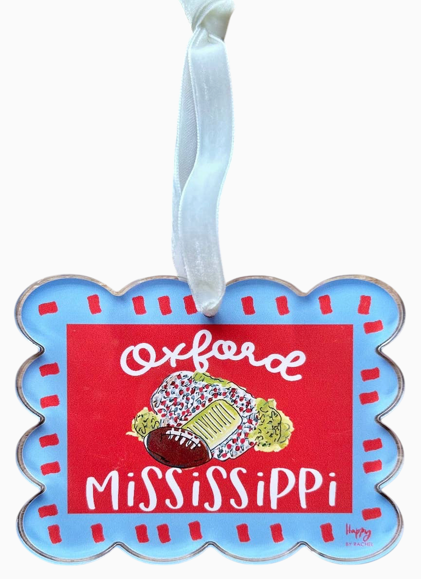 Miller Collective Oxford Mississippi acrylic stadium ornament with a red center, blue scalloped edge, and ribbon.