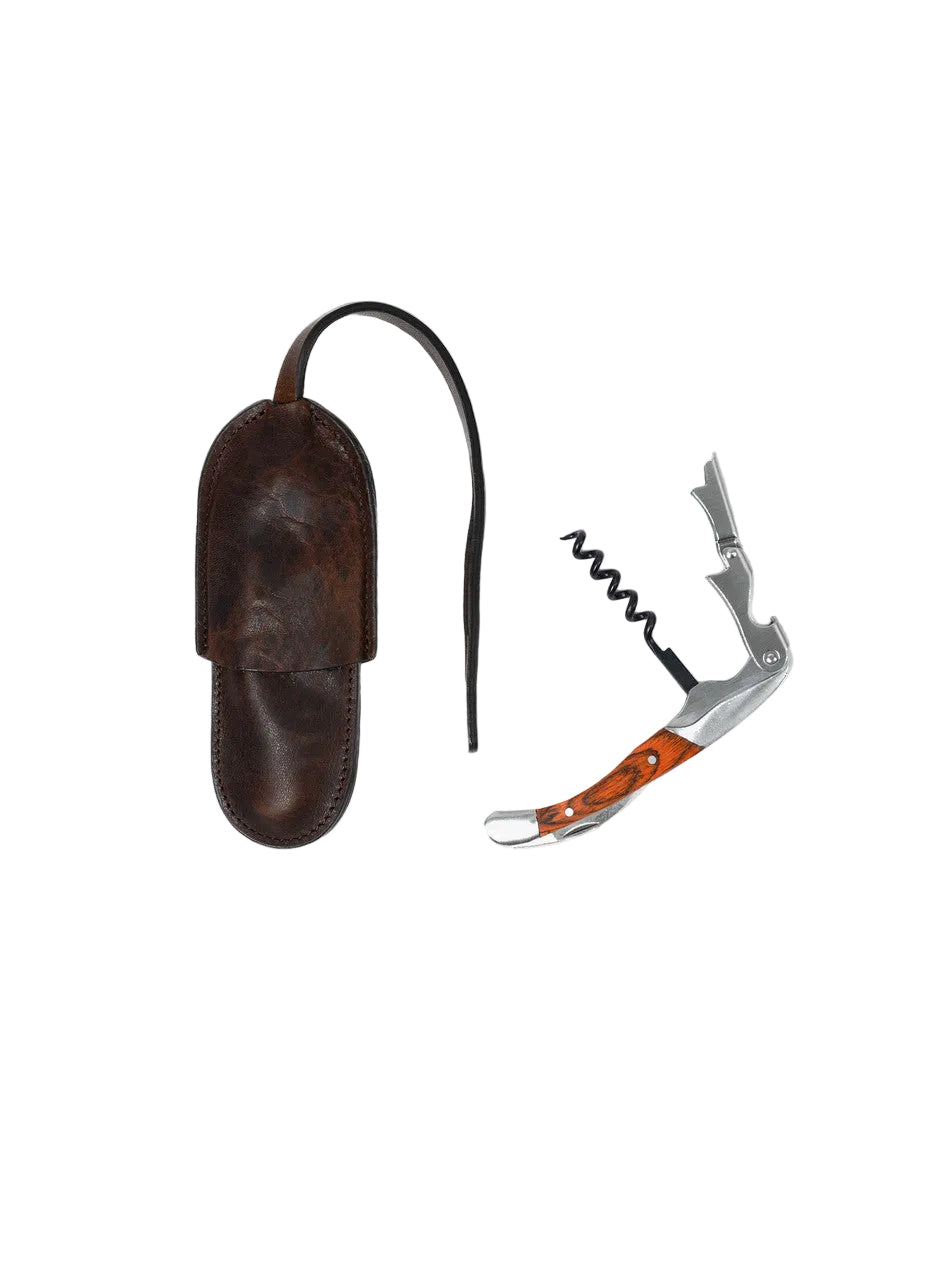 Corkscrew with leather sheath on a white background