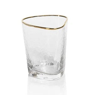 Clear glass with gold rim on a white background