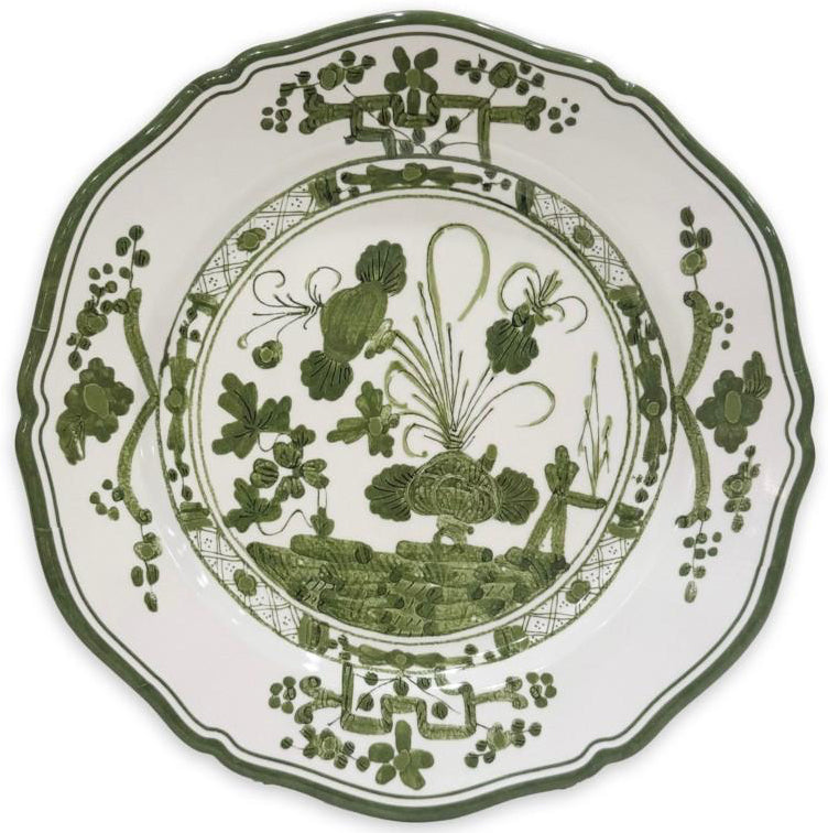 Decorative plate with green floral patterns on a white background