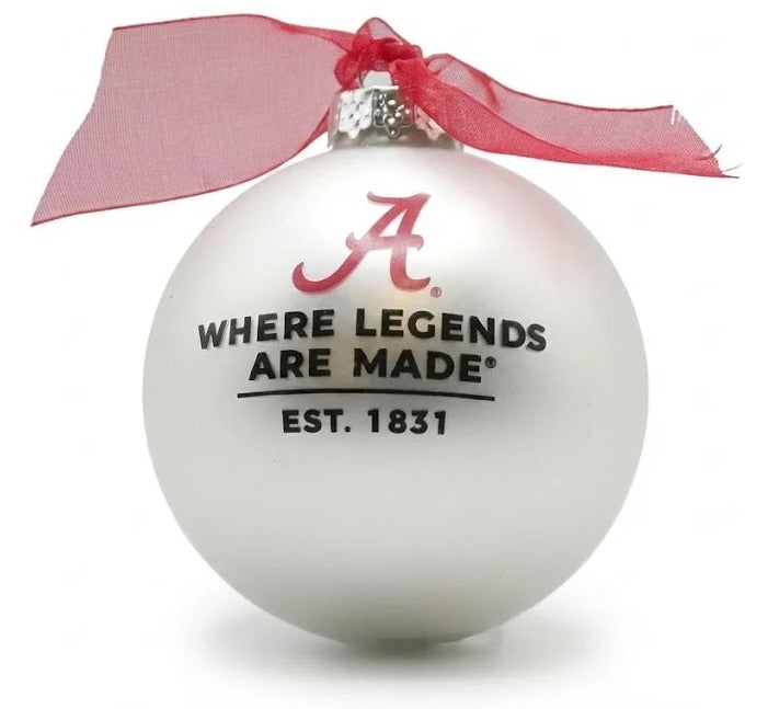 White ornament with red ribbon and text on a white background