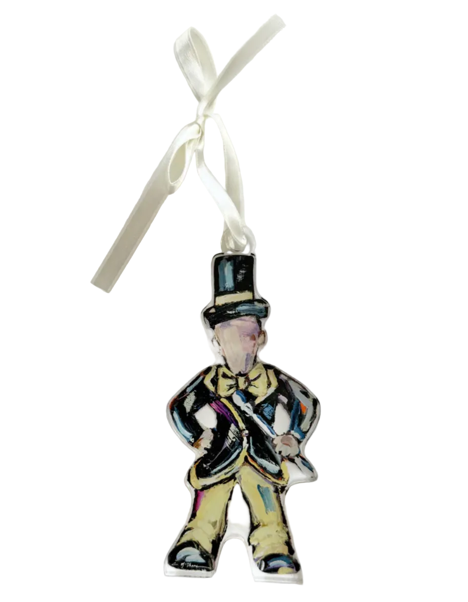 Decorative ornament shaped like a man in a top hat and suit on a white background
