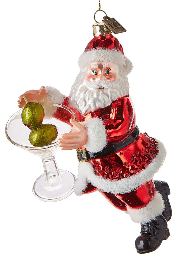 Decorative Christmas ornament of a Santa Claus holding a glass with green olives on a white background