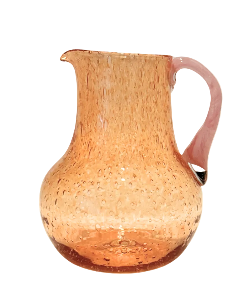 Woven pitcher on a beige background