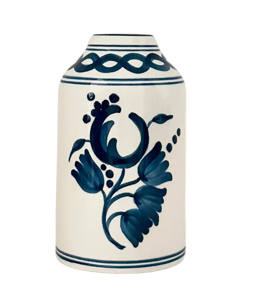 Ceramic vase with blue floral design on a white background
