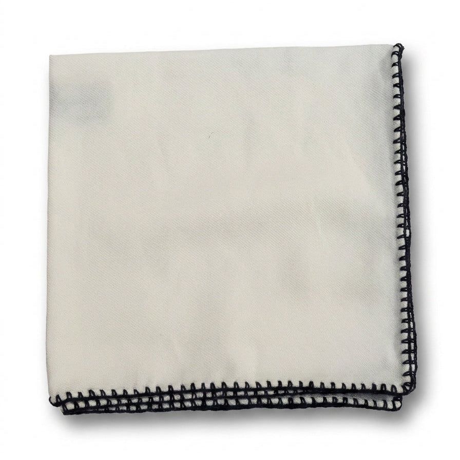 A folded white handkerchief with black stitched borders, displayed on a clean white background.