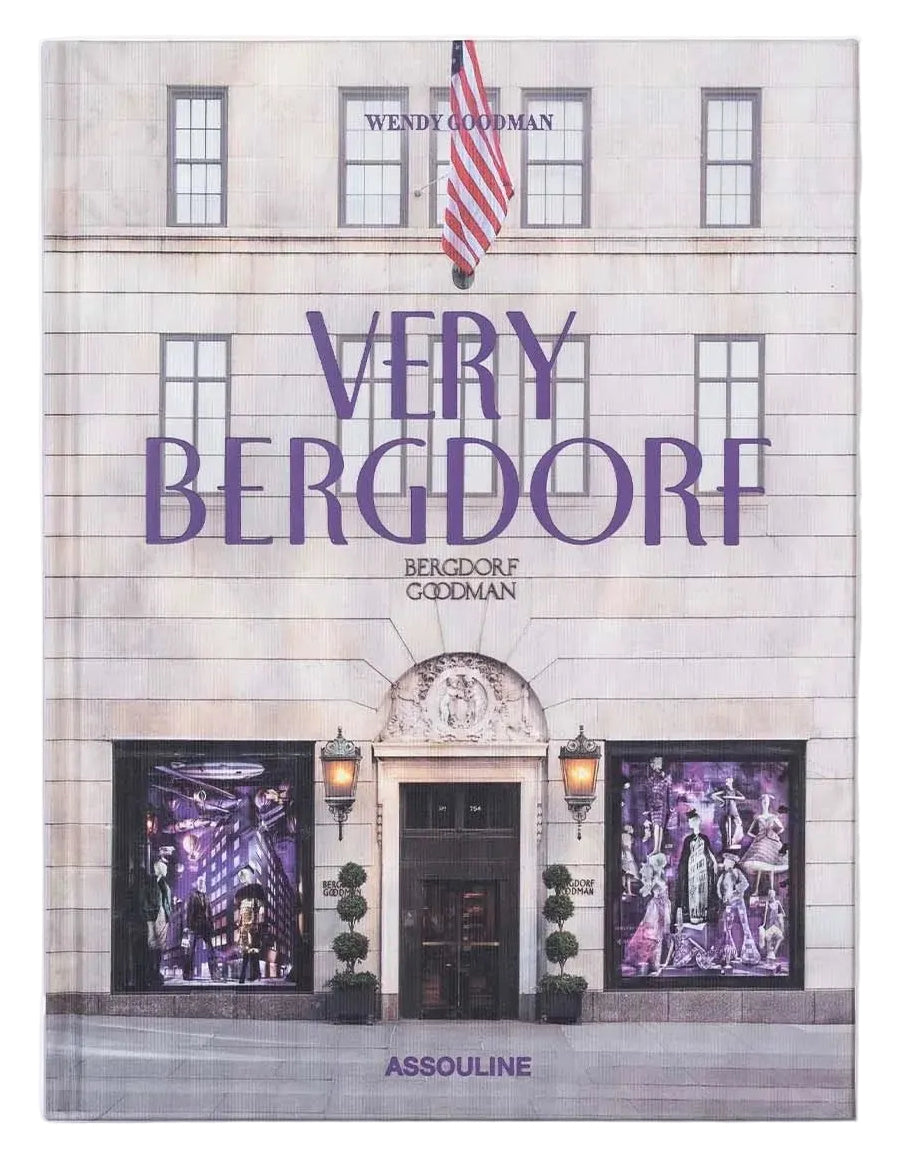 A hardcover art book titled 'Very Bergdorf' by Jessica Cohen, featuring a cover illustration of a grand building facade with purple title text and purple-toned window artwork, shown on a light gray background.
