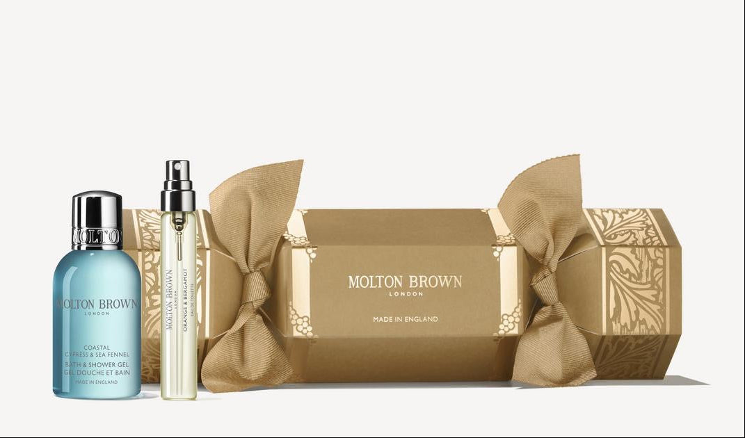 Molton Brown skincare products including a bottle, serum, and soap on a white background