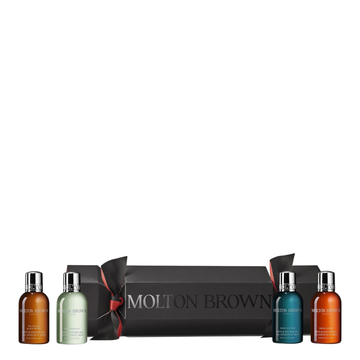 Miller Collective Woody Opulent Christmas Cracker gift set featuring four 50ml luxury bath and shower gel bottles.
