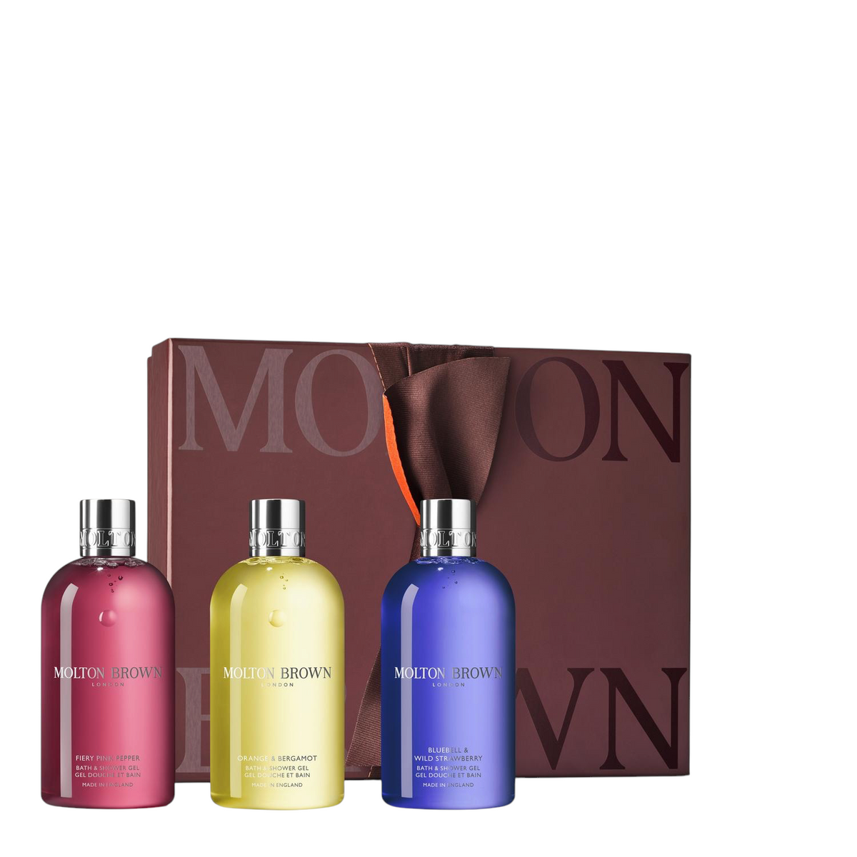Miller Collective Bathing Trio Gift Set featuring three scented shower gels in pink, yellow, and blue bottles.