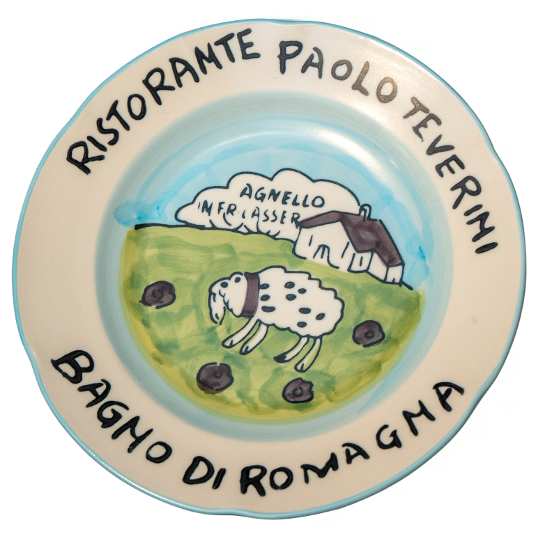 Ceramic plate with a sheep illustration and text on a white background