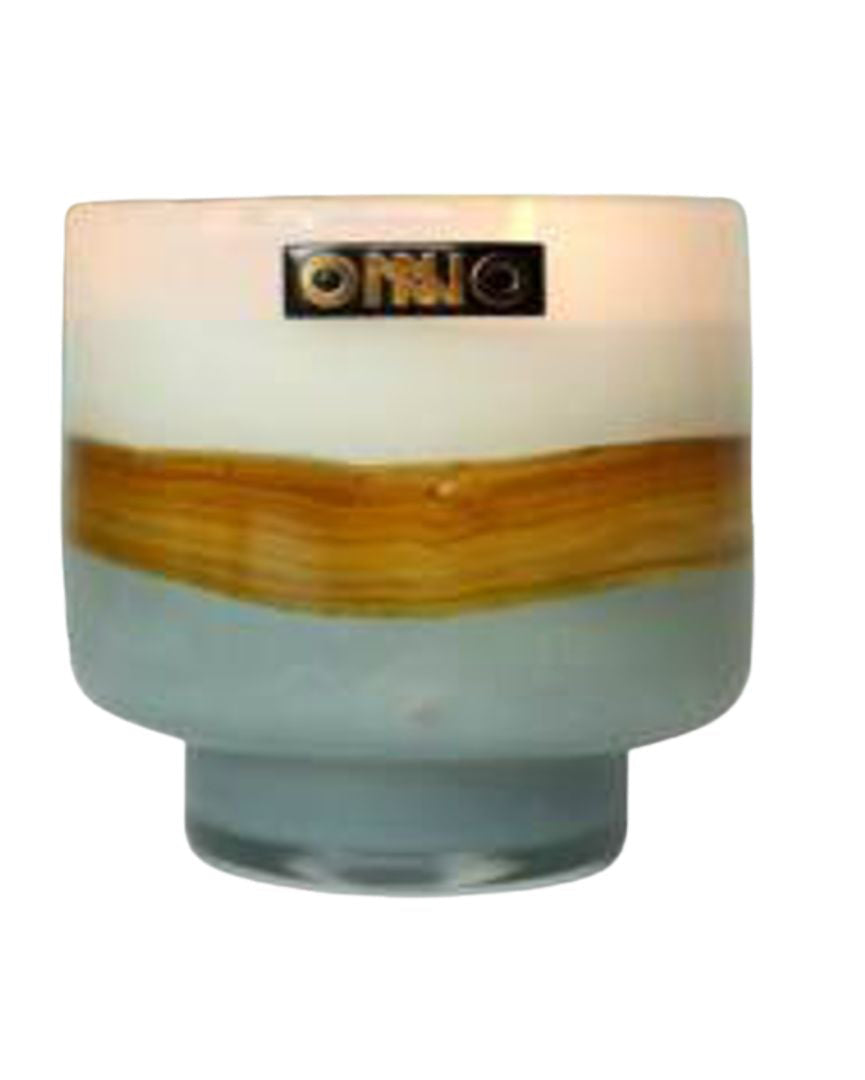 Cylindrical glass candle with wooden accent on a white background