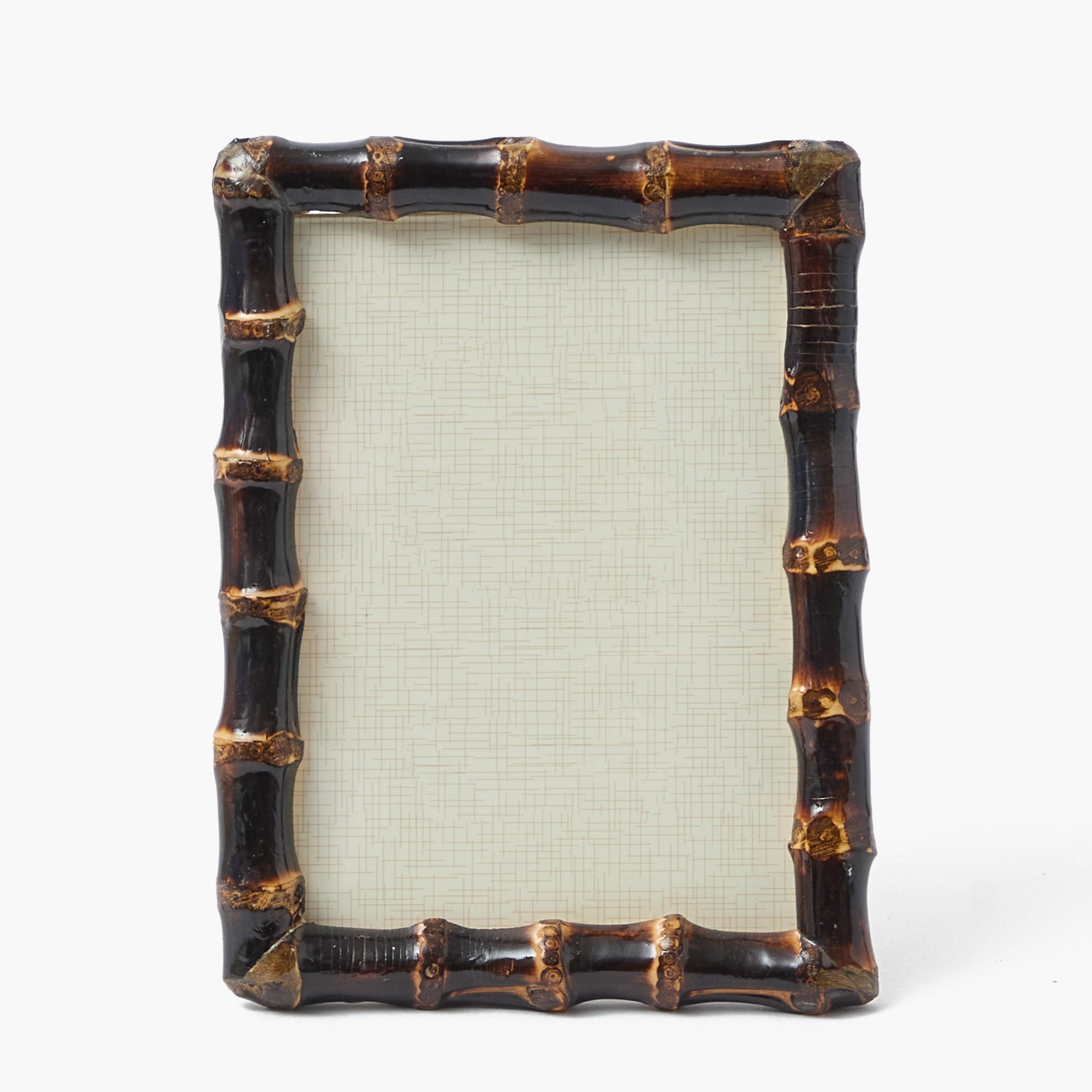 Decorative picture frame with a bamboo design on a white background