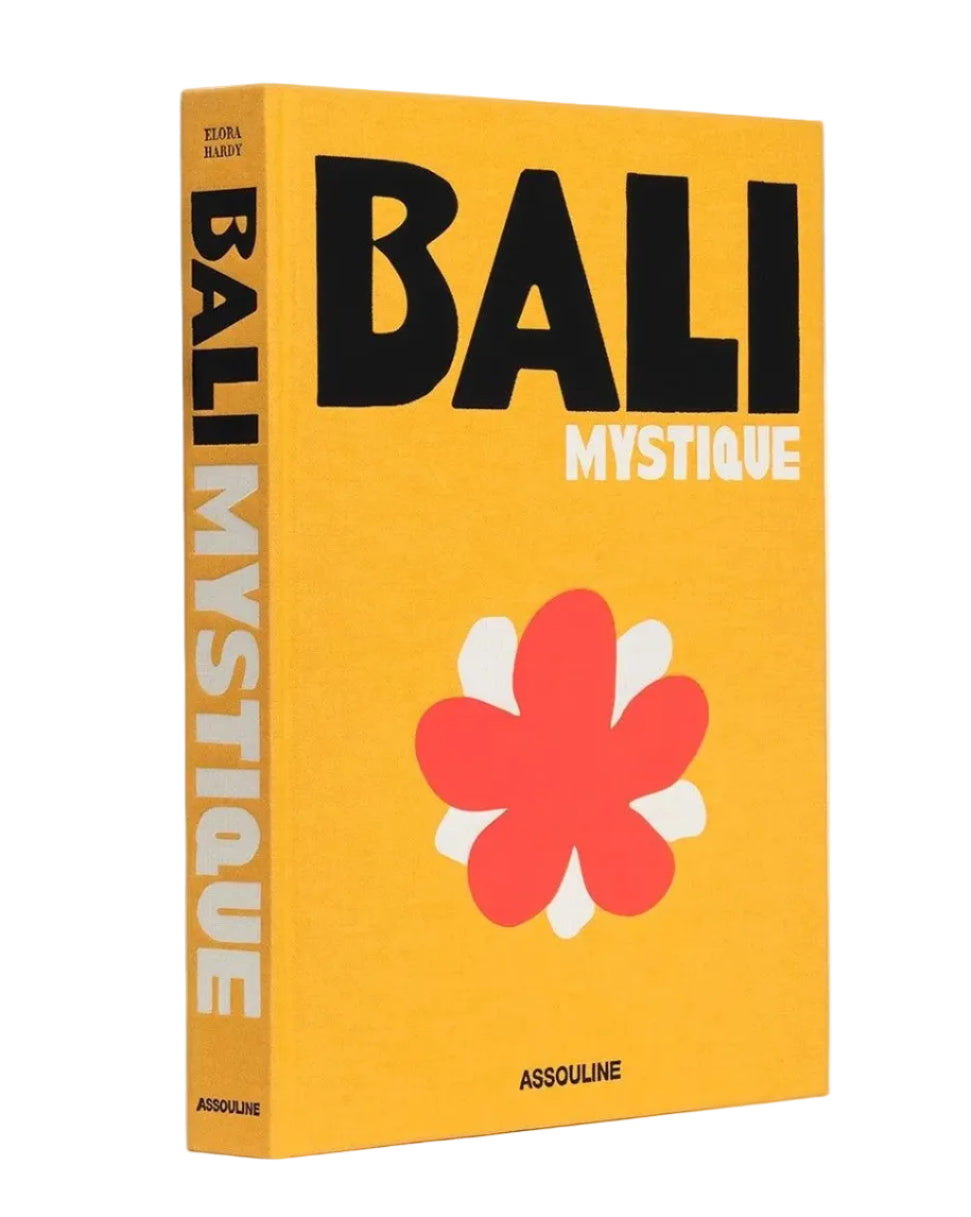 Book titled 'Bali Mystique' with a yellow cover and red flower design on a white background